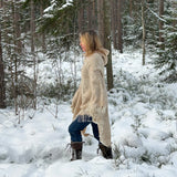 Bēšīga toņa garais 100% vilnas pončo ar kapuci un baltām bārkstīm