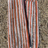 Oranžas, gaiši pelēkas, brūnas svītriņas, vilnas auduma grīdceliņš ~70x130cm